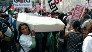 London March July 2014 Pro Palestine rally Naz Shah with coffin on her shoulder