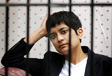 Director of human rights group Liberty, Shami Chakrabarti, looks through the bars of a cage outside the Houses of Parliament in London. Director of human rights group Liberty, Shami Chakrabarti, looks through the bars of a cage outside the Houses of Parliament as MPs debate the government's proposed anti-terror legislation, in London, March 9, 2005. The government has offered new concessions to speed through parliament controversial new anti-terror laws that are turning into a pre-election nightmare for Prime Minister Tony Blair. REUTERS/Kieran Doherty