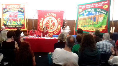 Jackie Walker speaking with John McDonnell on far-left