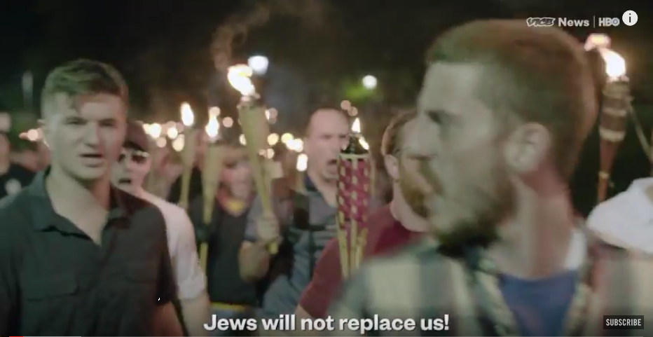 Trump's allies on the march in in Charlottesville chanting 'Jews will not replace us'