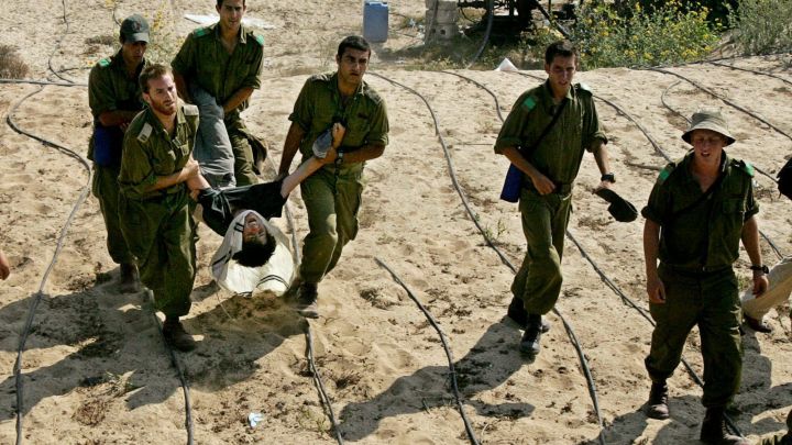 Israeli soldiers removing a Gaza settler